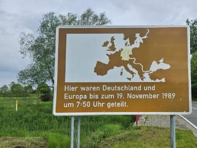 Marking the old border between East and West Germany in Schöningen, Lower Saxony. A brown road sign marking the old border between East and West Germany in Schöningen, Lower Saxony.