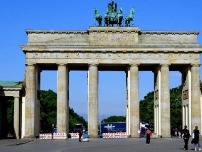 Brandenburg Gate before the hoards arrived. Brandenburg Gate in bright morning light with only a few people visible.